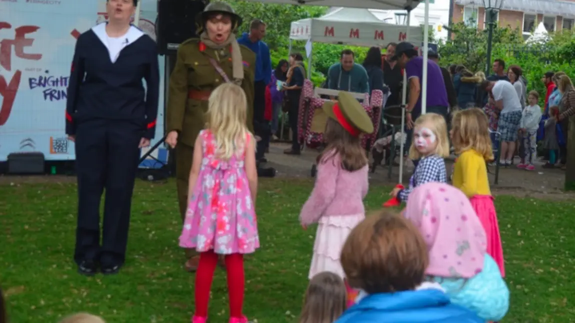Two women dressed in male first world war uniform at family event