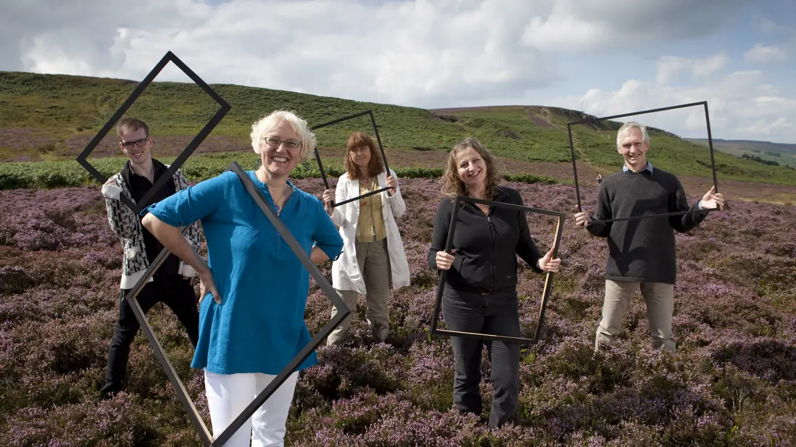 People holding up frames on the Watershed Landscape