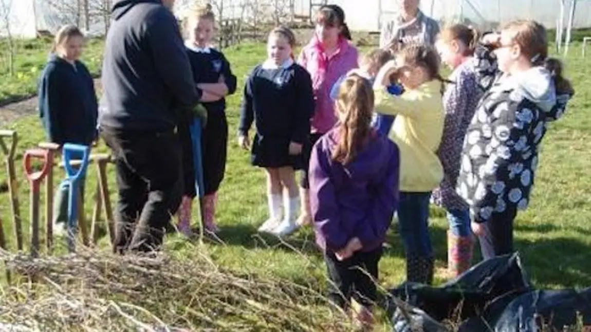School children being taught about the importance of hedgerow