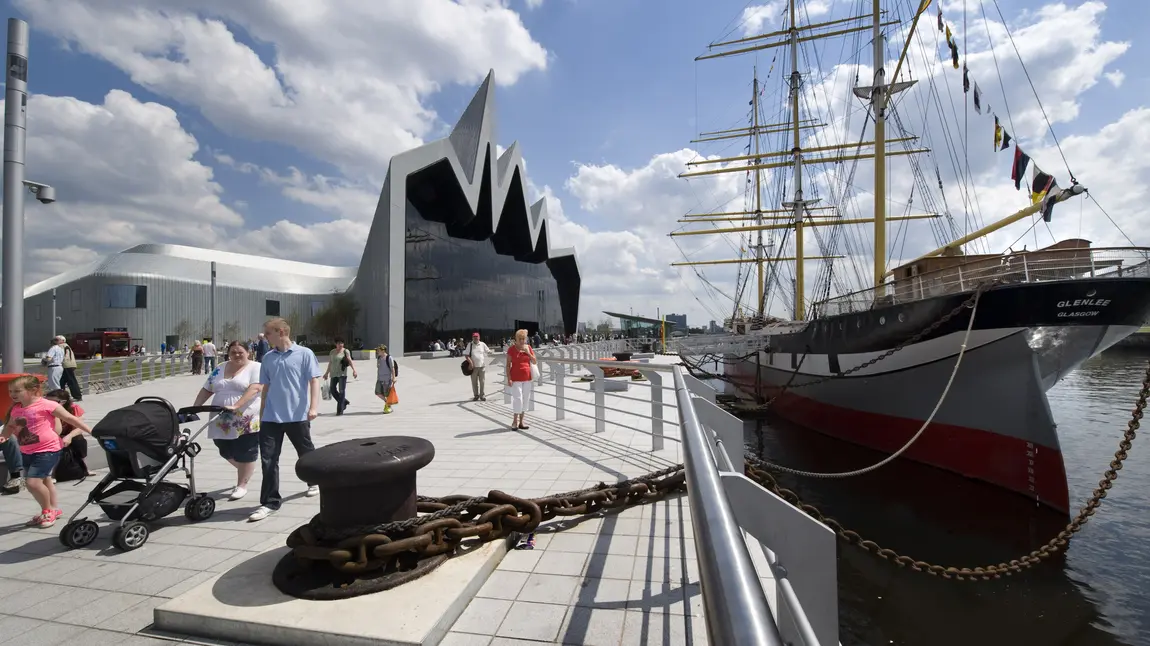 Visitors walk alongside Riverside Museum, Glasgow