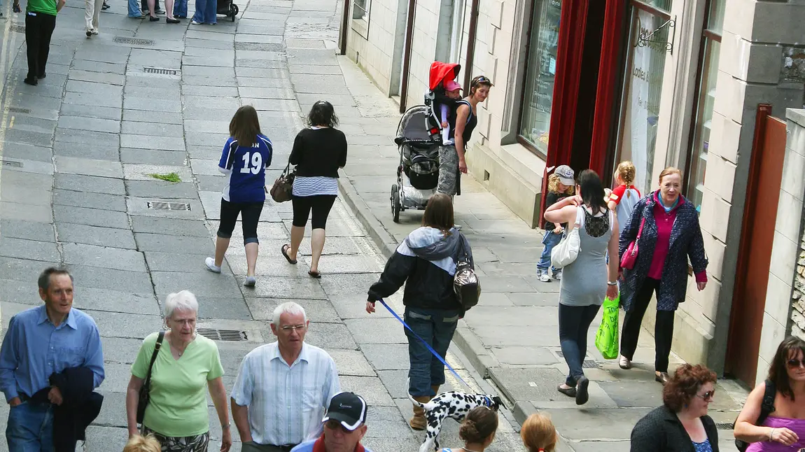 Visitors and shoppers on a street in Stromness