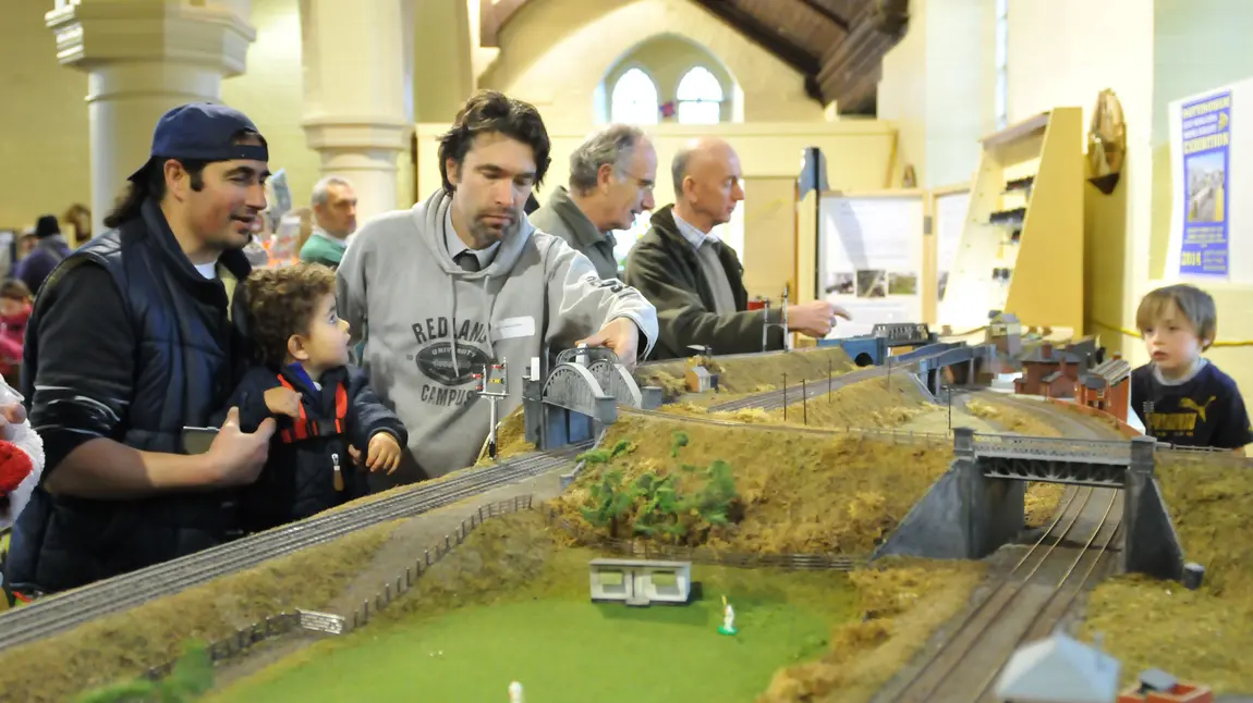 People look at a model railway