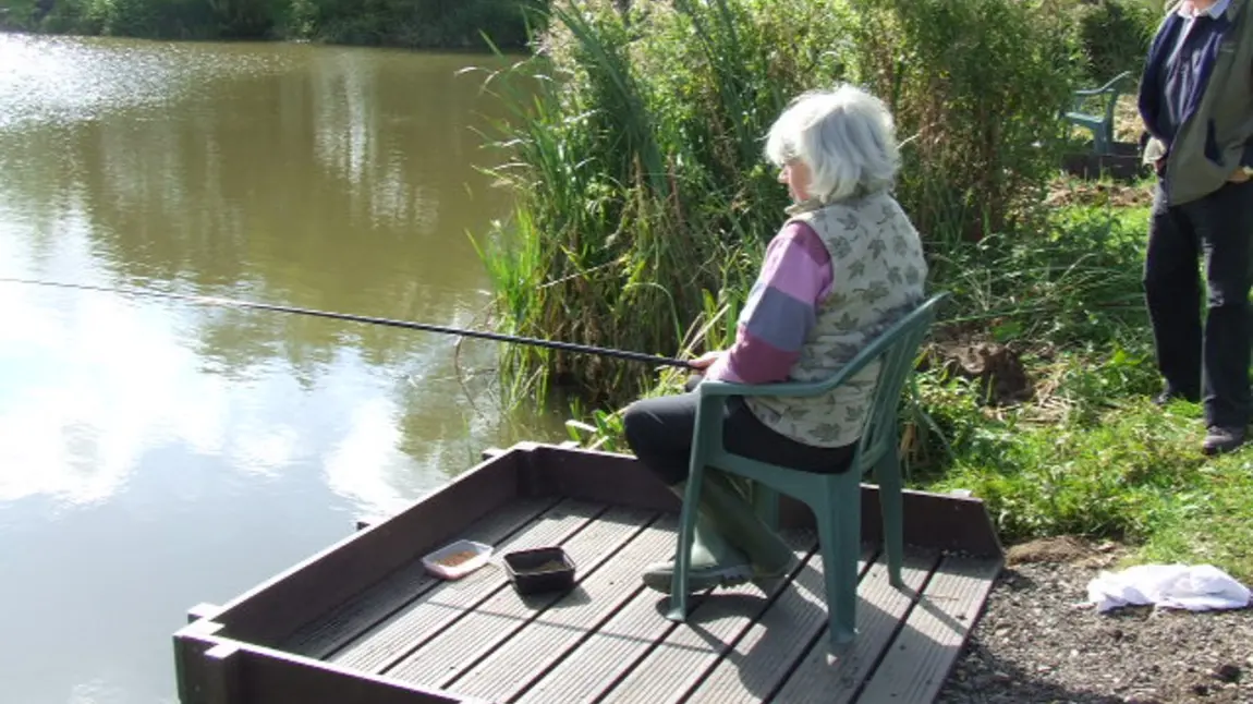 Woman fishing in the Trent Vale
