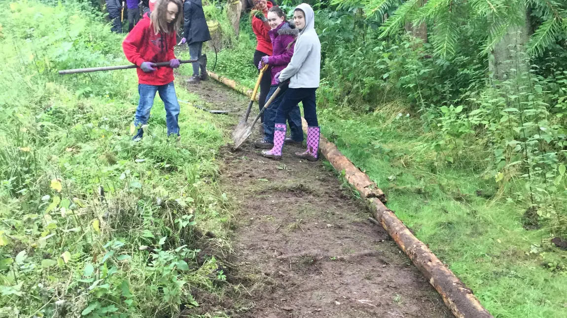 Young people clearing and maintaining paths