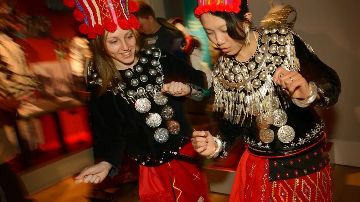 Young people learn a traditional dance in costume