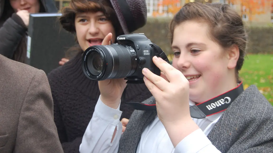 Young people making use of professional photography equipment