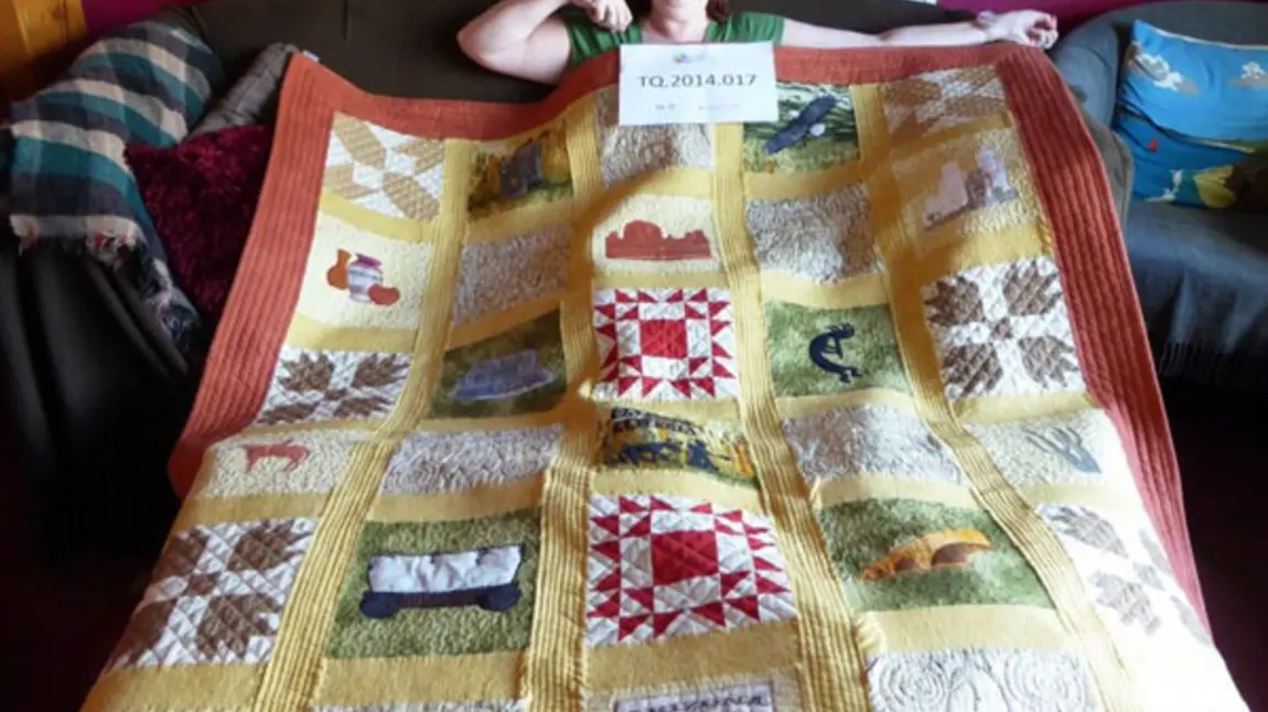 Interviewee Julie Edwards and her quilt