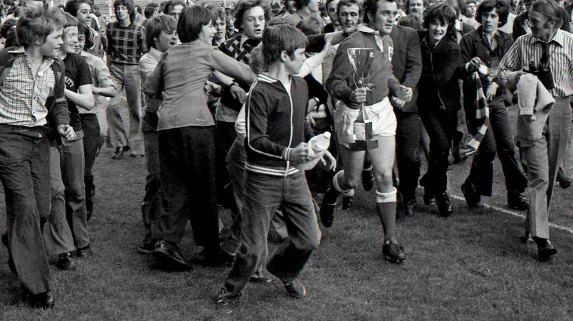Scarlets captain Phil Bennett surrounded by fans after the club were crowned Welsh 'cup kings' in 1975
