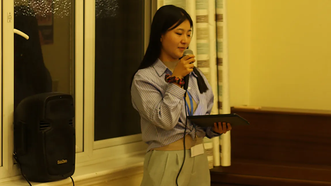A person speaks into a microphone