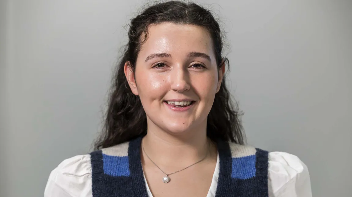 Hannah Clark has curly brown hair.