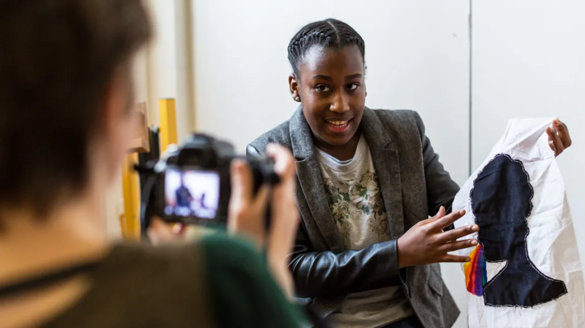 Young woman talks to camera