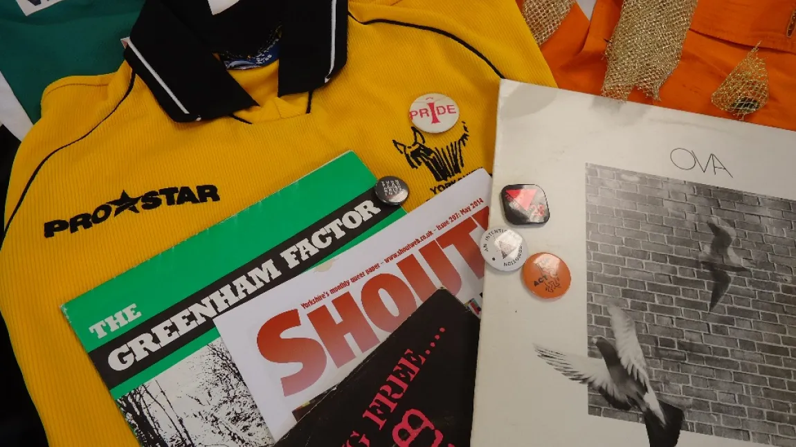 Archive materials including magazines, clothes and badges