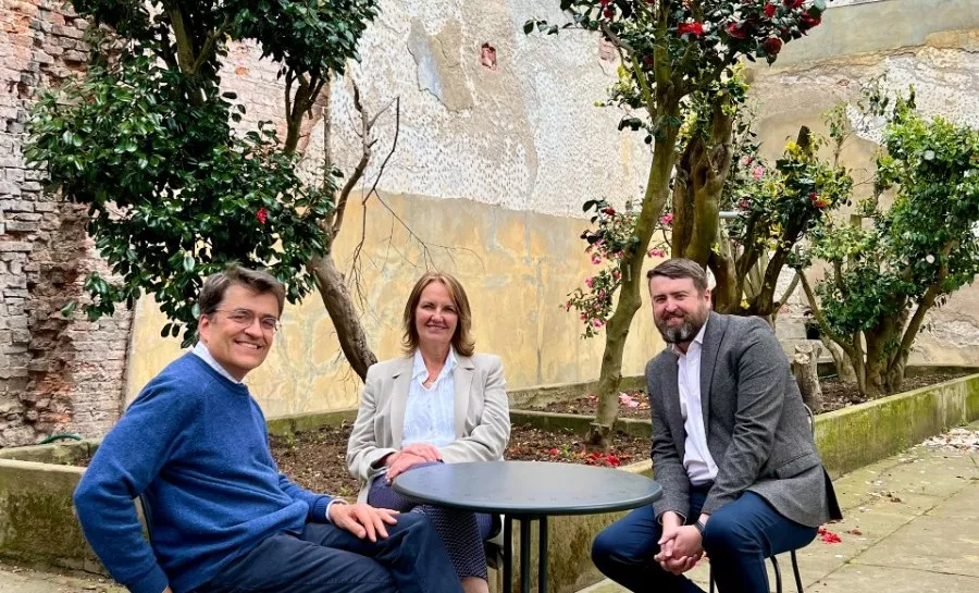 People sitting around a table outside