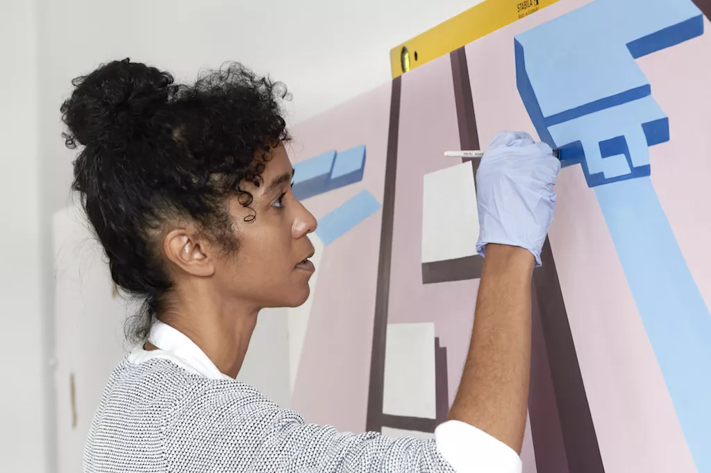 EASTSIDE PROJECTS.jpg Woman painting an art piece for Eastside Projects at Birmingham Festival 2022