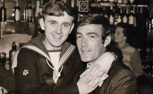 Plymouth LGBT Archivecrop.jpg Archive photo of a sailor and another man embracing in a pub