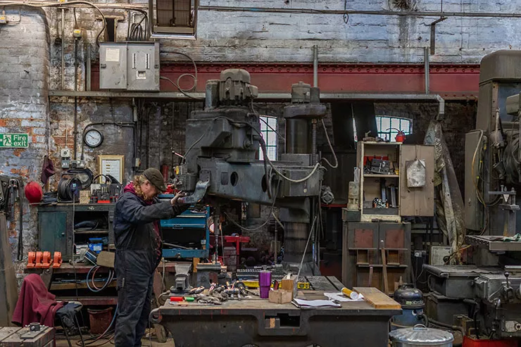 Taylor Bell Foundry Loughborough - employee working on creating a bell. Photography by Alex Wilkinson Media_0.jpg Taylor Bell Foundry Loughborough - employee working on creating a bell. Photography by Alex Wilkinson Media