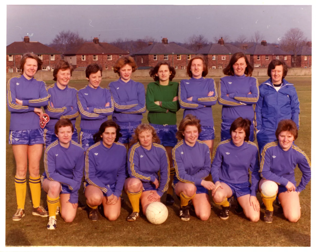 Group of women footballers line up for photo
